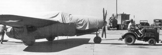 XP-59 fitted with wooden propeller and covered with shrouds to conceal the true source of its propulsion. (US Air Force)